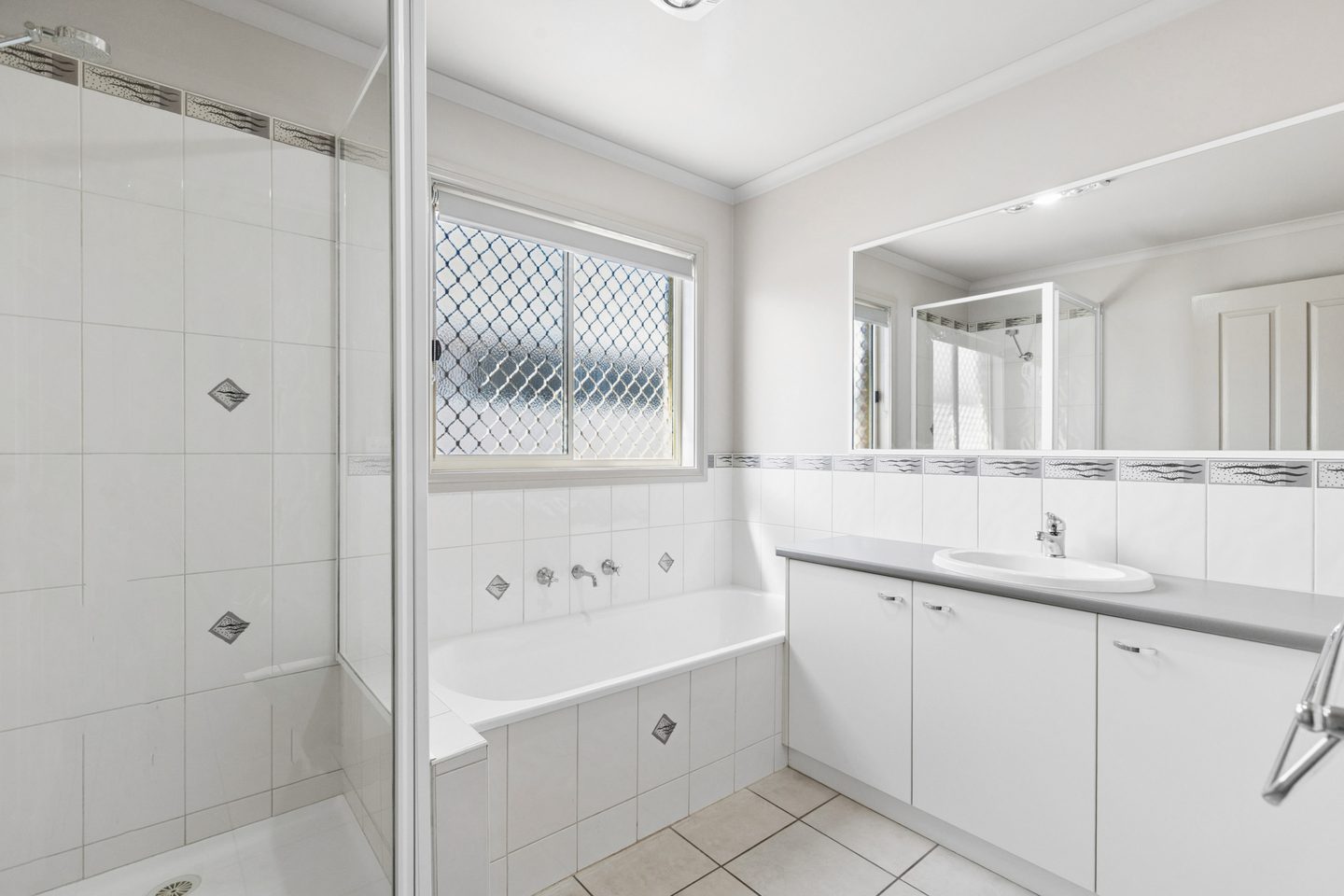 Family bathroom with a bathtub, separate shower and vanity