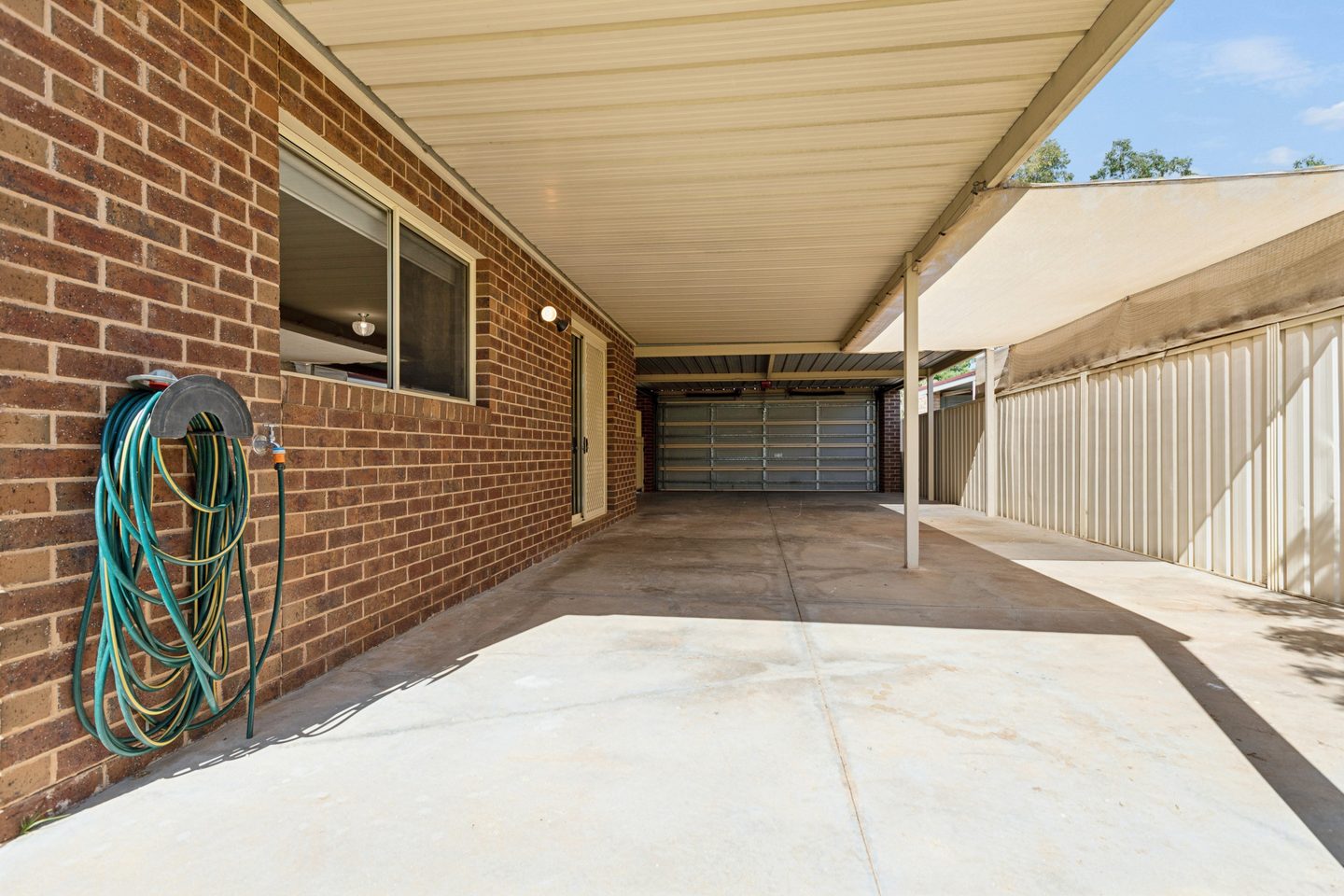 The covered side area, looking towards the carport