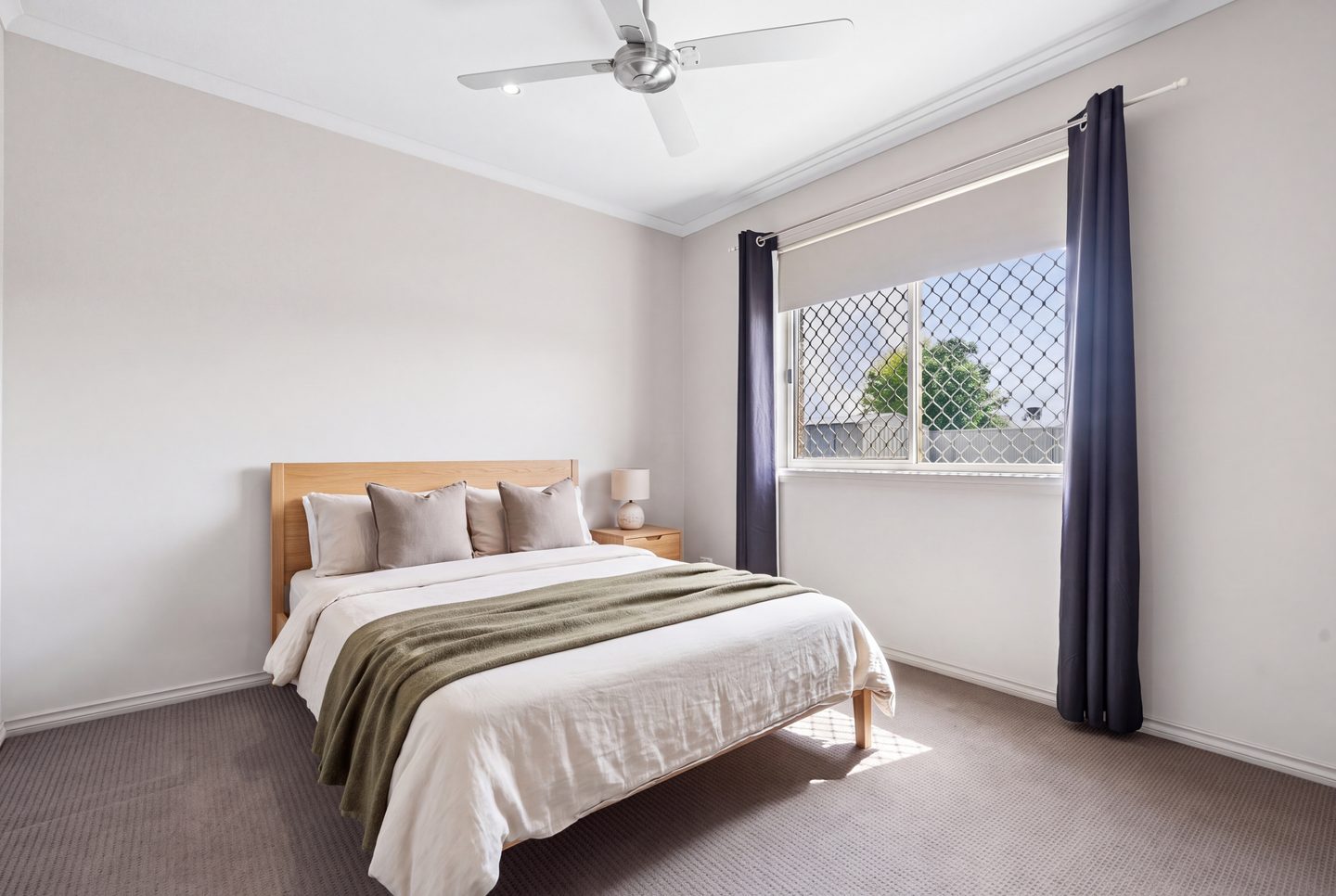 A bedroom with a large window
