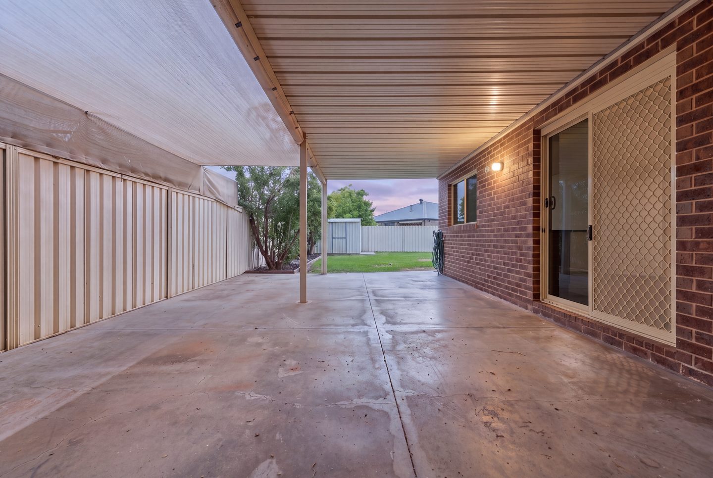 The covered patio at dusk